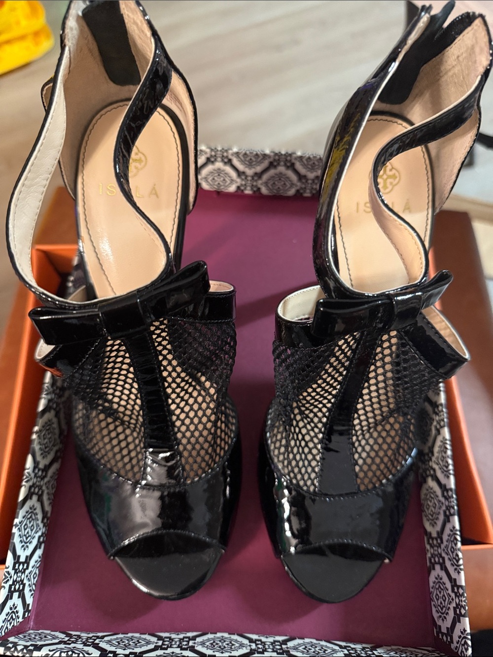 Isola Black Patent Mesh Peep-Toe Heels with Bow Accent